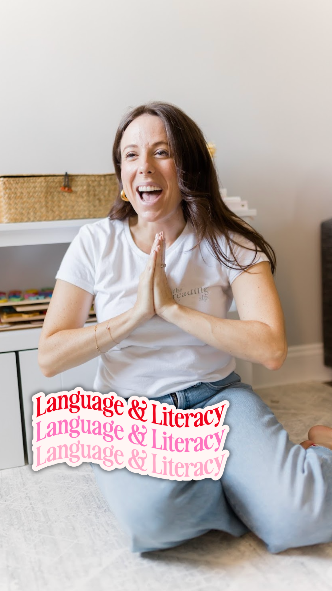 Elizabeth holding a literacy worksheet with the Not Just an SLP sticker